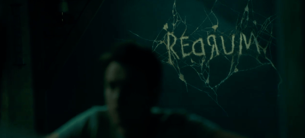 a darkened sign that says "Redrum"